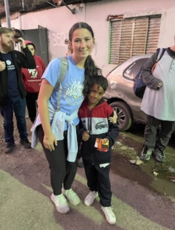  Olivia Koverdan
(10) posing with one of
the children she met while 
on a mission trip in São 
Paulo, Brazil. While there,
she shares the gospel and 
serves the community.
“One of the most exciting 
things was seeing the 
different culture and getting 
to meet all the new people,” 
Koverdan remarked.
