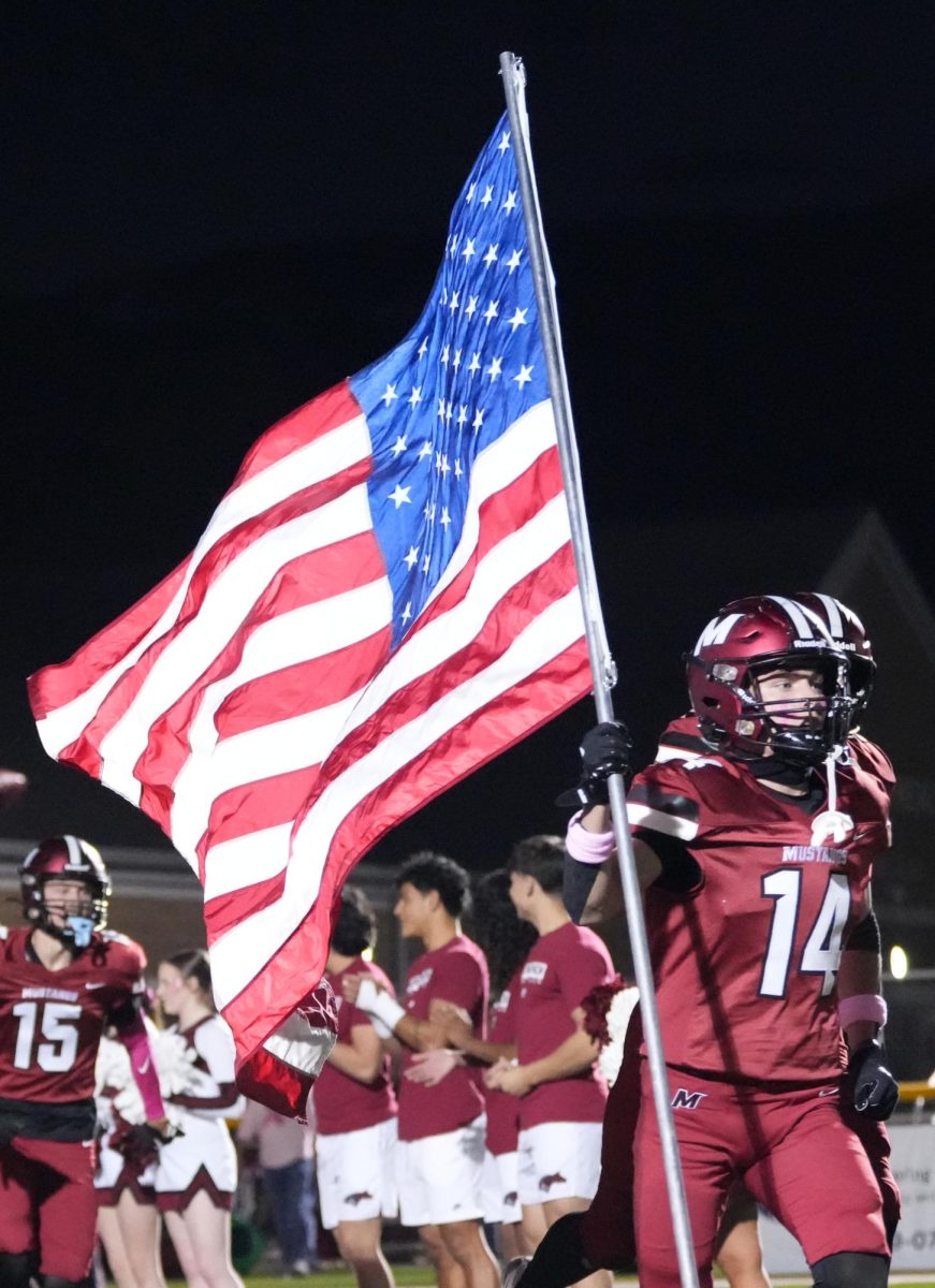 Players and cheer leaders doing their pre game run out at the Mccracken Vs. Christian County game on October 17. The mustangs always do their pre game run out during home games, but this game all the players were much more enthusiastic. "