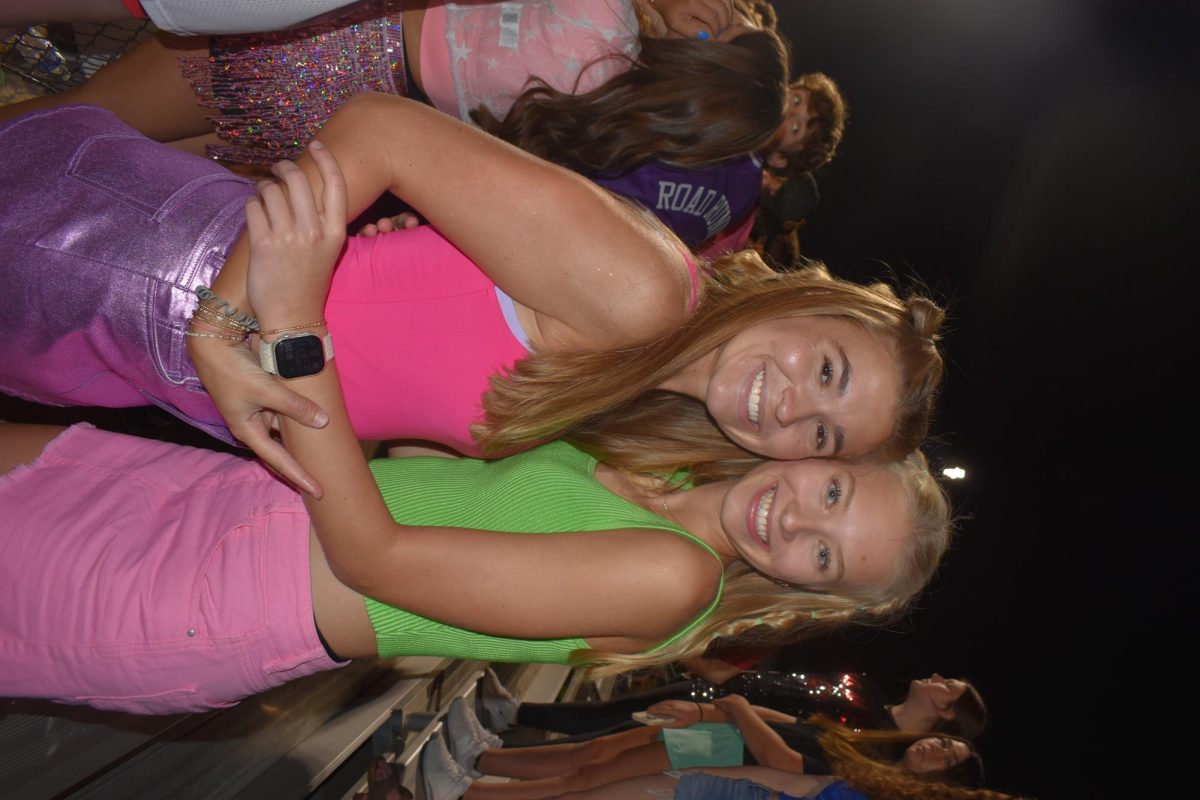 Madilyn Shelby (12) and Aniston Nelson (12) pose for a photo at a McCracken football game. 
