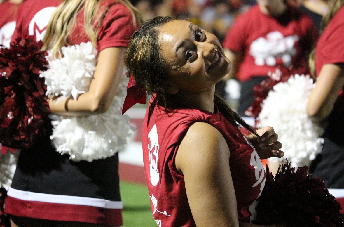 Supporting our team with spirit and smiles!