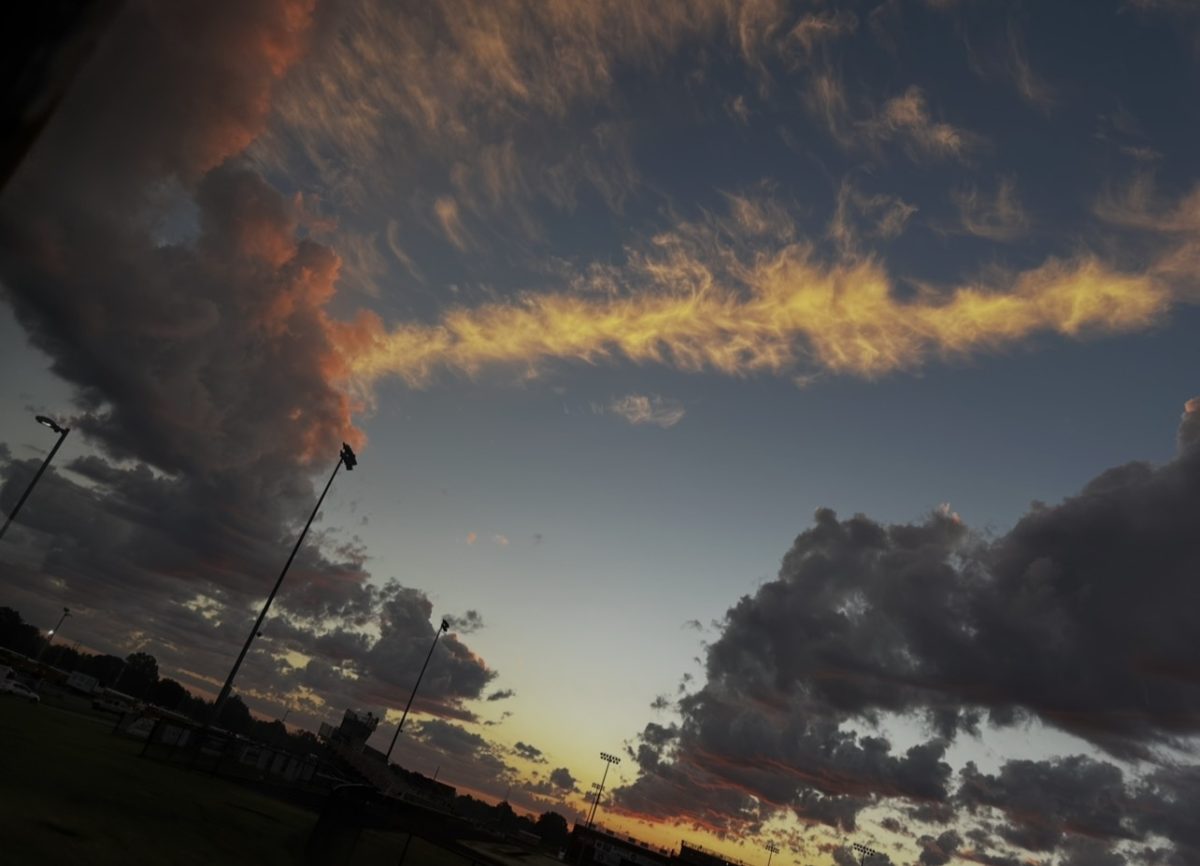 Lily Hegg taking a picture of the clouds on October 2nd after getting of the bus at MCHS. Sunrises always look better when the light hits the clouds just right. 