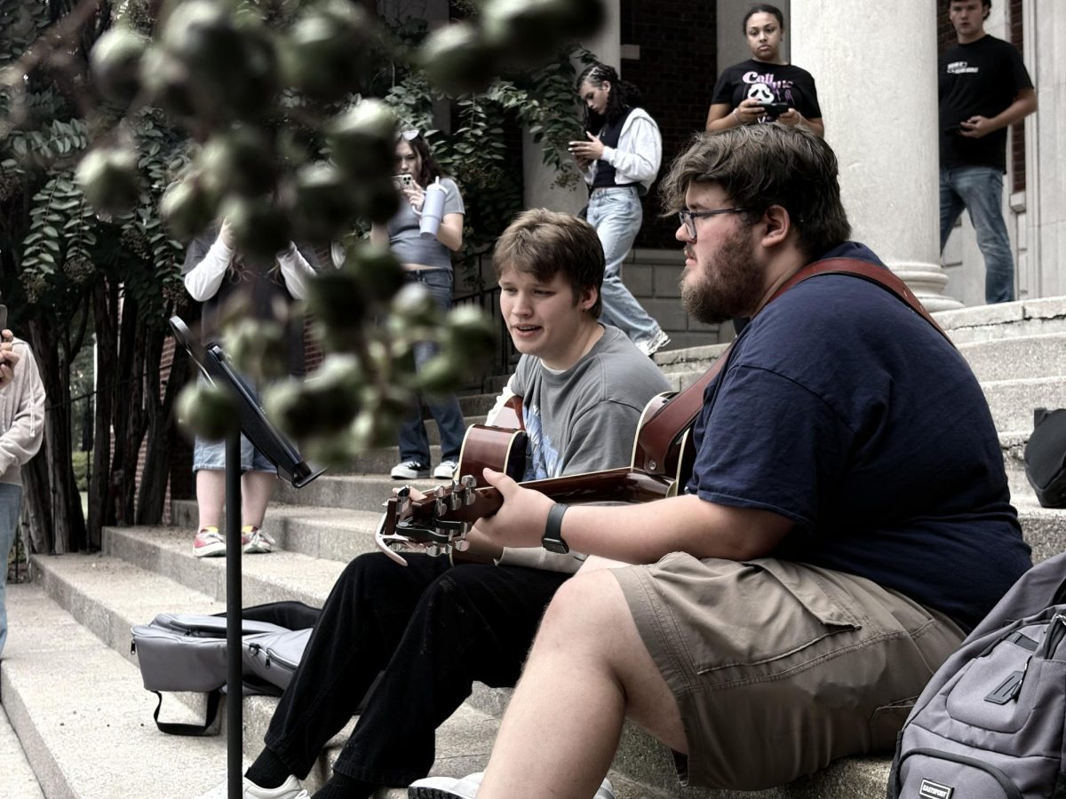 Musical Walk-Through.
One part of the MSU trip was the Photo Walk. Upwards of 30 students walked throughout the campus, stopping to take pictures of…anything, really. If it could make for a good photo, you could take a stab at it. Here we passed by a couple of musicians–and our group lingered here for a moment, trying to get that perfect candid.
This one I managed to capture on our way.