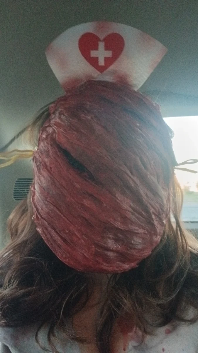 Halloween Mask 
Student Katelyn McNeely wearing her Halloween mask that she made herself, its the mask for the Nurses from Silent Hill. Making the mask took the entire week, and included many last minuet supply runs. When seeing the mask Moth Guzman said "oh wow it's heavy."