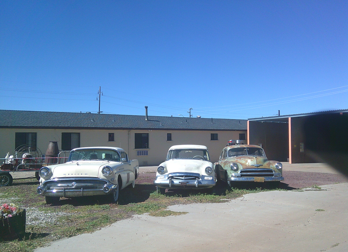 Three older model cars parked in a parking lot in Williams, Arizona. Williams, Arizona is where Route 66 is and what inspired the town in the "Cars"  movies. "We walked around and ate lunch, which was a super cool experience.", Luca Bakemier explained. 