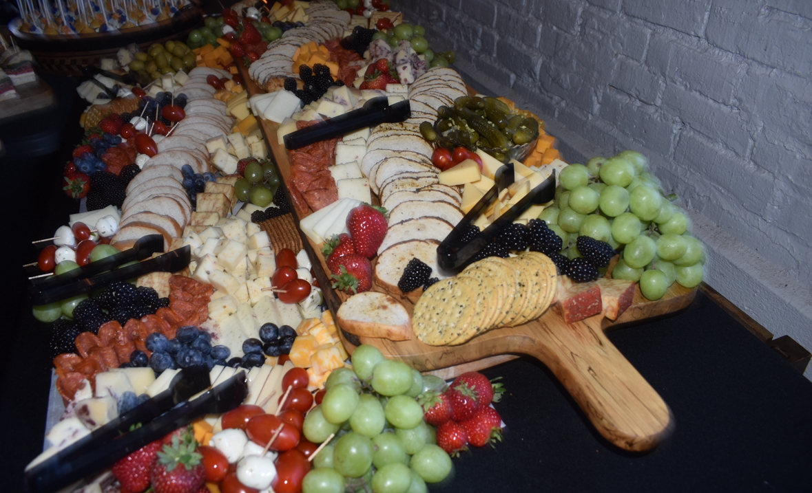 A beautifully plated charcuterie board served at my moms wedding reception. The reception was downtown at "Barrel and Bond", a popular destination for events. "Charcuterie boards are my favorite, so I am glad we had one at the wedding", Mike Martin said.