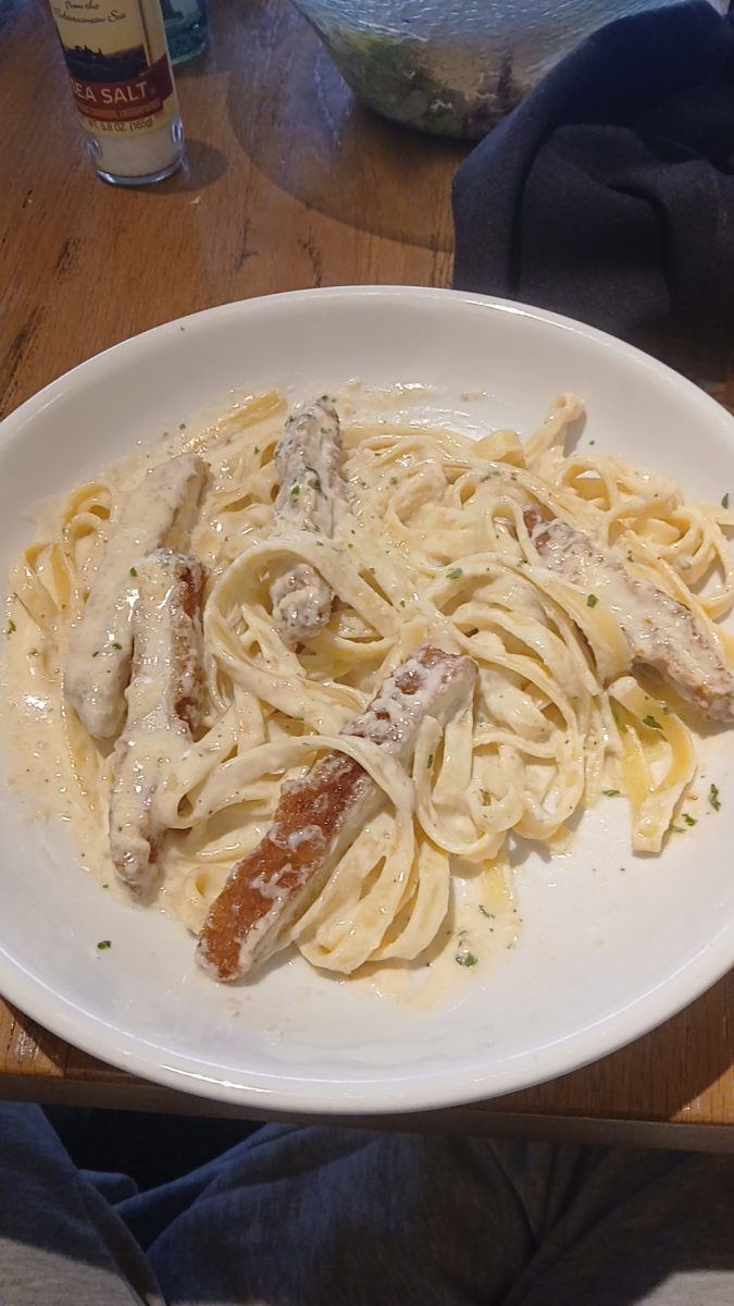 A plate of Alfredo pasta with fried kitchen from Olive garden. Katelyn went out to eat with her Grandmother for lunch. When seeing the plate of food her Grandmother said "I know I got the right plate."