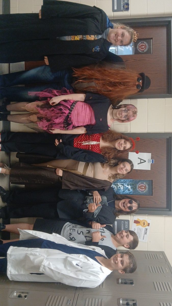 Mr.Trefil´s 3rd hour A day class posing for a picture on Halloween. Everyone who dressed up in a costume that day was taken out into the ELC and included in the picture.