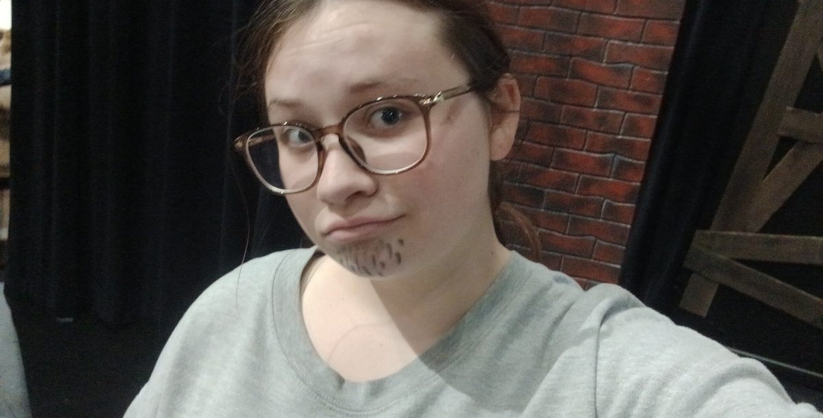 Student Katelyn McNeely in costume for group preformance in Drama 3. Mrs.Bowden gave the class an assignment to write an orgional 5 minuet one act that would be preformed next week and each group had three people in it. When helping Katelyn put on her beard senior Morgan Thomas said " I think you just like having charectors who wear beards."